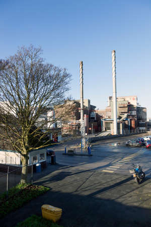 glass factory of Royal Leerdam in dutch town of Leerdam in the netherlands under blue skyのeditorial素材