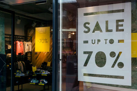 sale and seventy percent discount in clothing storeの写真素材