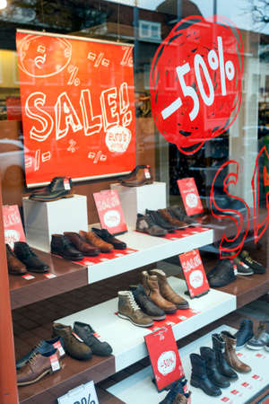 sale and discount in display window of shoe storeの写真素材