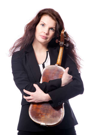 classical brunette beauty in suit holds violin in studio against white backgroundの写真素材