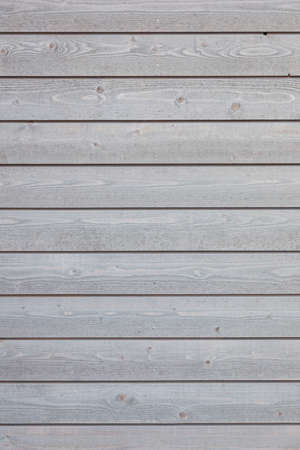 vertical part of horizontal planks with light grey varnishの写真素材