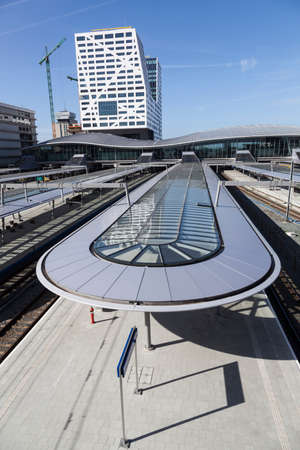 utrecht, 15march 2017: new railway station utrecht seen from footbridge on sunny spring day in the netherlandsのeditorial素材