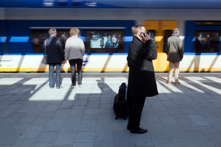 Utrecht, netherlands, 15 march 2017: man makes phone call on platform of new central railway station...