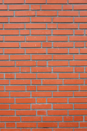 vertical part of orange brick masonry wallの写真素材