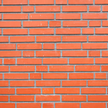 square part of orange brick masonry wallの写真素材