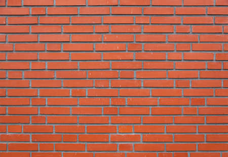 horizontal part of orange brick masonry wallの写真素材