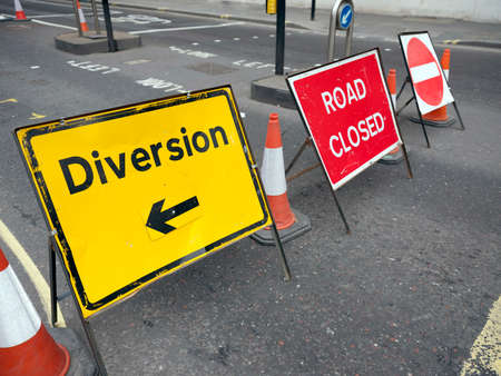 colorful road signs with the words diversity and road closed on london street