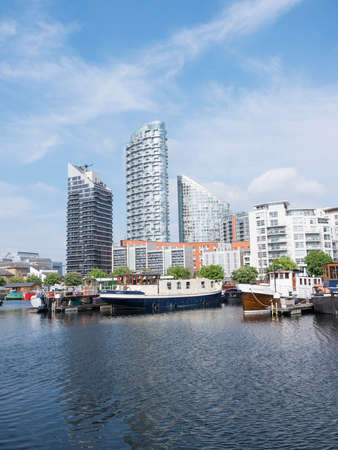 London, United Kingdom, 7 may 2017: house boats and apartment buildings in london docklands near canary wharfのeditorial素材