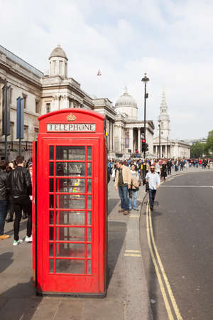 London, United Kingdom, 6 may 2017: red telephone box and a lot of people on the street near national gallery and trafalgar square in londonのeditorial素材