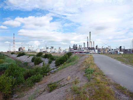 antwerpen, Belgium, 26 june 2017: esso refinery in belgian port of antwerp seen from schelde dikeのeditorial素材