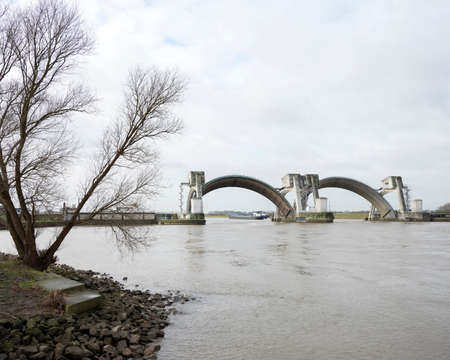 hydroelectric station and weir in river rhine near Mourik in the netherlandsの写真素材
