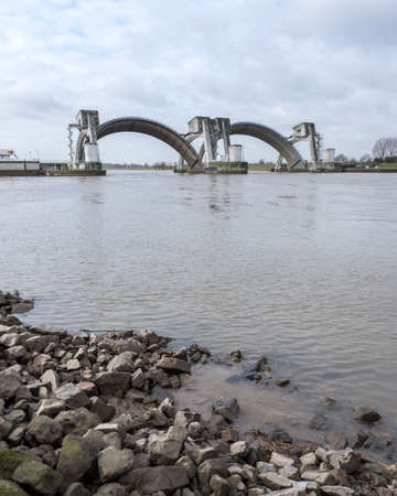 hydroelectric station and weir in river rhine near Mourik in the netherlandsの写真素材