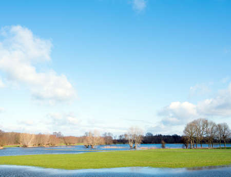 flooded flood plains of river ijssel near Zalk between Kampen and Zwolle in the netherlandsの写真素材