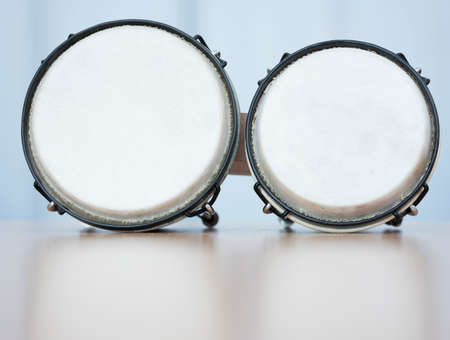 pair of bongos for children on reflecting surface in studioの写真素材