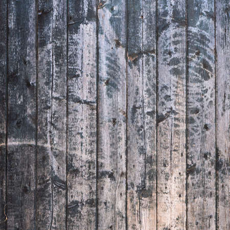 background consisting of old brown grey grungy part of wooden barn doorの写真素材