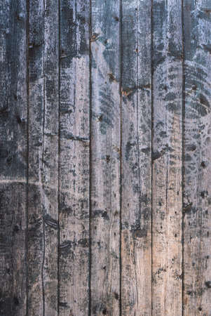 background consisting of old brown grey grungy part of wooden barn doorの写真素材