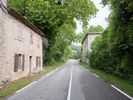 old houses with shutters and ivy along provence road in southern franceの写真素材