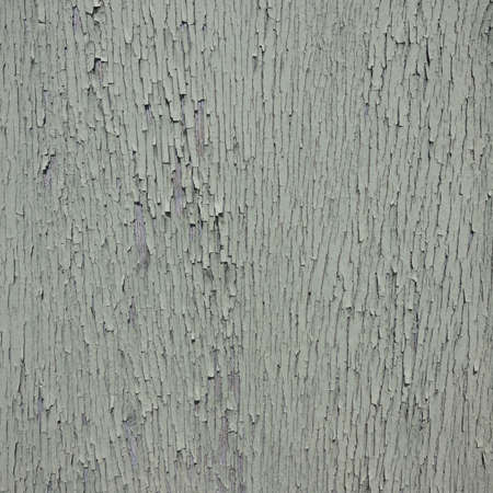 closeup of cracked peeling green paint forming almost abstract backgroundの写真素材