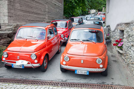 Introd, Italy, 28 july 2018: old fiat 500 cars of members of fiat club in narrow italian streetのeditorial素材