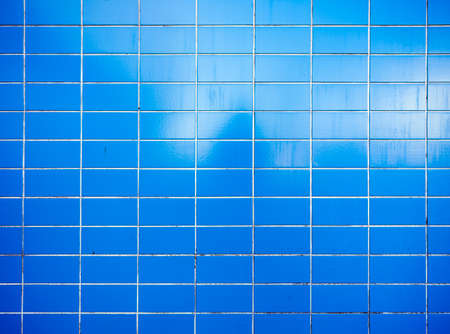 horizontal pattern of bright blue dirty tiles