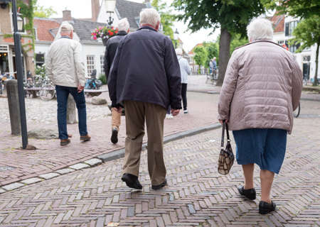 amersfoort, netherlands, 15 june 2019: seniors on old street in dutch town of amersfoort in the netherlandsのeditorial素材