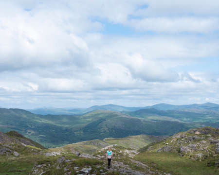 dursey, ireland, 25 july 2019: girl hikes on dursey island off the west coast of beara peninsula in irelandのeditorial素材