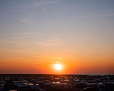 sunset over a lot of caravans on german campingside in the north near north sea in late summerの写真素材