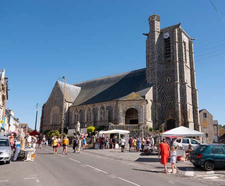 people at market stalls near church of ault in french normandyのeditorial素材