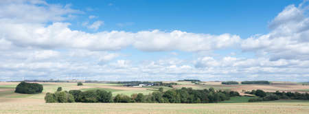 farm and fields on high plane neer Cochem in german voreifel and wind turbinesの写真素材