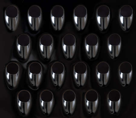 pattern formed by closeup of holes in kitchen graterの写真素材