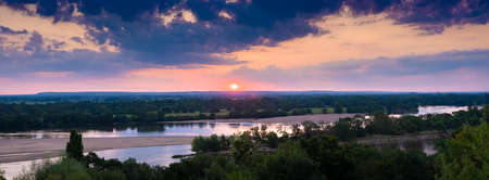 sunrise over river loire and landscape around it between tours and angersの写真素材