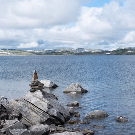 rocks and water of lake on hardangervidda in norwayの写真素材