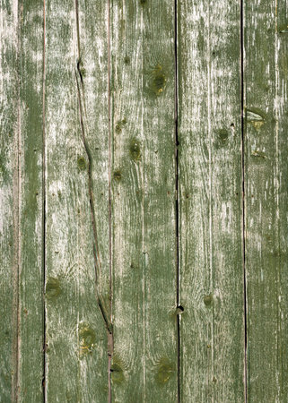 old worn wooden boards with weathered green paintの写真素材