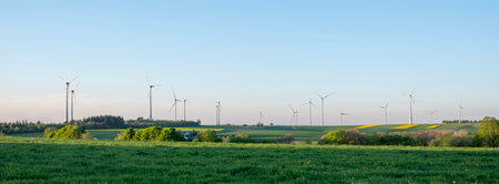 German countryside with wind turbines under blue sky in Saarland in springの写真素材