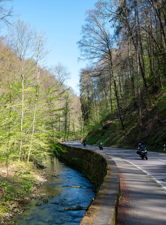 muellertal, luxembourg, april 29, 2025: motorcycles on the road through the muellertal on sunny day in springの写真素材