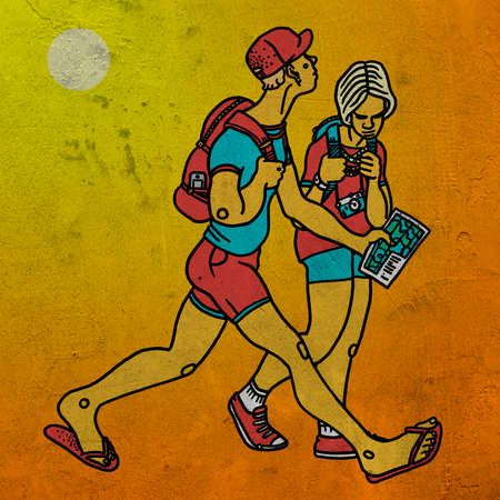 Young couple traveling with map and backpack on yellow backgroundの写真素材