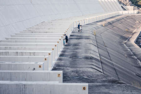 biker on a Dam of reservoir, outdoorのeditorial素材