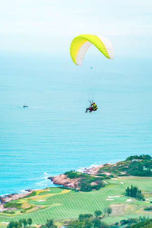 Paragliding above the ocean in Hong Kong Countrysideの写真素材