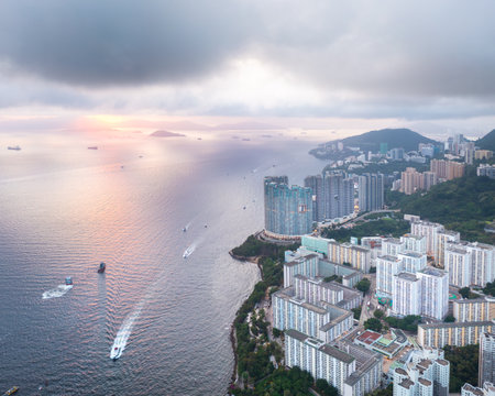 amazing drone shot of sunset in Aberdeen, Hong Kong. Famous tourist location and combining old and residential area.の写真素材
