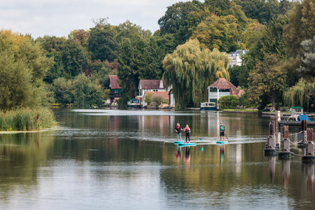 Ative persons in canoe on river, Amazing view of Goring and Streatley, village town near Reading,...