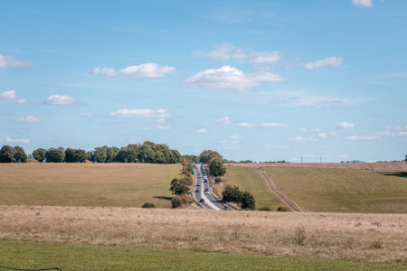 Hiking man walking in the field, Amazing view of Goring and Streatley, village town near Reading, England.の写真素材