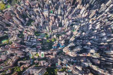 Over top view of the dense overcrowded skyscraper in Sheung Wan and Central district of Hong Kong, daytime, aerial viewの写真素材