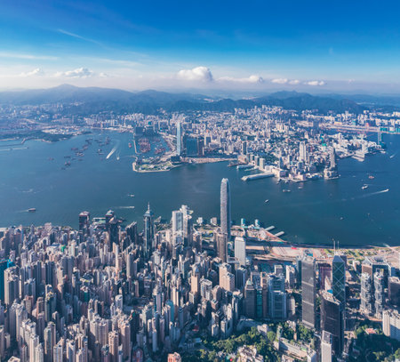epic panorama of the Victoria Harbour and commercial area of Hong Kong, outdoor, daytime, aerial viewの写真素材