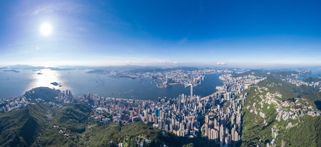 epic panorama of the Victoria Harbour and commercial area of Hong Kong, outdoor, daytime, aerial viewの写真素材