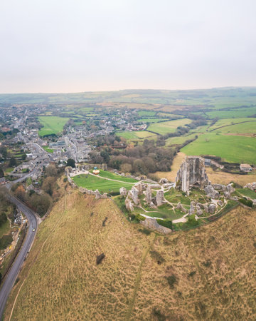 amazing aerial view of Corfe Castle, aerial view of the famous historical site and the village,...