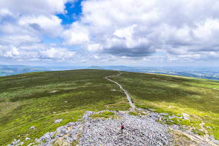 Hiker Backpacker on the mountain of Abergavenny, wales, England, summer outdoorの写真素材