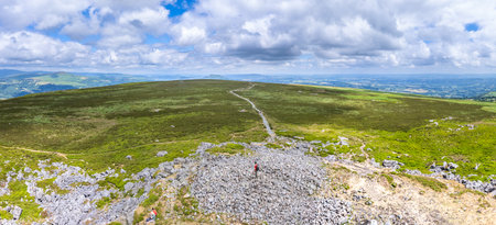 Hiker Backpacker on the mountain of Abergavenny, wales, England, summer outdoorの写真素材