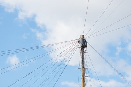 Utility pole with lots of cables connected, England, UKの写真素材