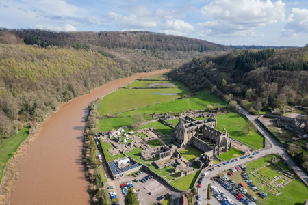 Amazing aerial panorama of Tintern Abbey, River Wye, and the nearby landscape, UK