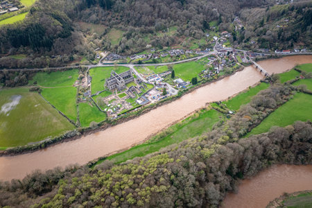 Amazing aerial panorama of Tintern Abbey, River Wye, and the nearby landscape, UKの写真素材